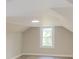 Angled view of a bedroom with light-colored walls and a window at 112 Hampton St, Chester, SC 29706