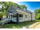 Exterior angle of a charming home featuring dormer windows, gray siding, and a welcoming front porch at 112 Hampton St, Chester, SC 29706