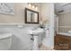 Charming bathroom features a pedestal sink and decorative mirror at 121 33Rd Ne Ave, Hickory, NC 28601