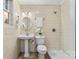 Bathroom features a pedestal sink, tiled walls, shower, and toilet at 121 33Rd Ne Ave, Hickory, NC 28601