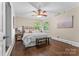 Cozy bedroom with a ceiling fan, hardwood floors, and lots of natural light at 121 33Rd Ne Ave, Hickory, NC 28601