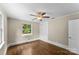 Neutral bedroom with a ceiling fan, closet, hardwood floors, and natural light at 121 33Rd Ne Ave, Hickory, NC 28601