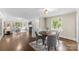 Dining room open to living area, featuring hardwood floors, neutral paint, and modern decor at 121 33Rd Ne Ave, Hickory, NC 28601