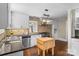 Charming kitchen features white cabinets, stainless steel appliances, and butcher block island at 121 33Rd Ne Ave, Hickory, NC 28601