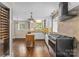 Kitchen boasts stainless steel appliances, white cabinetry, and hardwood floors at 121 33Rd Ne Ave, Hickory, NC 28601