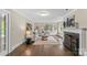 Bright living room features a fireplace, hardwood floors, and large windows with natural light at 121 33Rd Ne Ave, Hickory, NC 28601