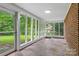 Enclosed sunroom featuring walls of windows offering views of the backyard at 121 33Rd Ne Ave, Hickory, NC 28601