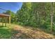 An expansive backyard with trees and greenery at 126 Meadow Glen Dr, Troutman, NC 28166