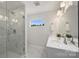 Bathroom featuring a glass shower and double sink vanity with decorative greenery at 126 Meadow Glen Dr, Troutman, NC 28166