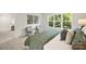 Inviting bedroom featuring a comfortable bed, stylish decor, and a large window offering scenic views at 126 Meadow Glen Dr, Troutman, NC 28166