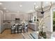 Modern kitchen with stainless steel appliances, gray cabinets, and stylish bar stools at 126 Meadow Glen Dr, Troutman, NC 28166