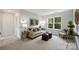 Comfortable living room with neutral-toned furniture, a large window, and stylish decor for relaxation at 126 Meadow Glen Dr, Troutman, NC 28166