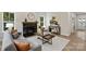 Bright living room featuring a fireplace, a comfortable sofa with pillows, and a stylish decor at 126 Meadow Glen Dr, Troutman, NC 28166