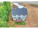 Aerial view of a two-story home showcasing a private backyard, and a spacious deck at 126 Meadow Glen Dr, Troutman, NC 28166