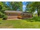 Lovely backyard with brick home and wooden deck, perfect for outdoor relaxation and entertaining at 141 Dunlap Loop, Statesville, NC 28625