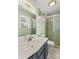 Bright bathroom featuring modern fixtures, marble countertops, and updated shower at 141 Dunlap Loop, Statesville, NC 28625