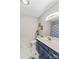 Modern bathroom with marble countertops, updated fixtures, and patterned shower curtain at 141 Dunlap Loop, Statesville, NC 28625