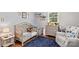 Charming bedroom featuring hardwood floors, natural light, and a cozy decor at 141 Dunlap Loop, Statesville, NC 28625