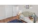 Bright bedroom with hardwood floors, built-in closet, and neutral paint at 141 Dunlap Loop, Statesville, NC 28625