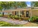 Charming brick ranch home with a cozy front porch and meticulously maintained landscaping at 141 Dunlap Loop, Statesville, NC 28625