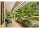 Cozy covered front porch with seating, overlooking a beautifully landscaped yard at 141 Dunlap Loop, Statesville, NC 28625