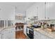 Functional kitchen featuring stainless steel appliances, granite countertops, and ample cabinet space, perfect for cooking and storage at 141 Dunlap Loop, Statesville, NC 28625