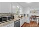Modern kitchen with granite countertops, stainless steel appliances, and ample cabinet space, perfect for culinary enthusiasts at 141 Dunlap Loop, Statesville, NC 28625