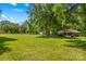 Expansive yard with mature trees and a shed, offering ample outdoor space and serene surroundings at 141 Dunlap Loop, Statesville, NC 28625