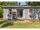 The backyard features a small patio, sliding glass doors, and an AC unit at 142 Idlebrook Rd, Statesville, NC 28677