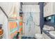 This bathroom features a shower with a floral curtain, toilet and a small vanity at 142 Idlebrook Rd, Statesville, NC 28677