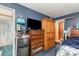 This bedroom showcases a TV, wood dresser, and wooden wardrobe, offering functionality at 142 Idlebrook Rd, Statesville, NC 28677