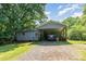Charming single story home featuring a carport and mature trees at 142 Idlebrook Rd, Statesville, NC 28677