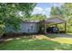 Charming single story home featuring a carport and mature trees at 142 Idlebrook Rd, Statesville, NC 28677