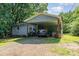 Charming single story home featuring a carport and mature trees at 142 Idlebrook Rd, Statesville, NC 28677