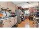 Kitchen featuring stainless steel appliances, light colored cabinetry and wood floors at 142 Idlebrook Rd, Statesville, NC 28677