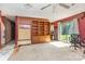 Spacious living room with a ceiling fan, red walls, and carpet flooring at 142 Idlebrook Rd, Statesville, NC 28677