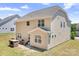 Exterior view of a home featuring a backyard with an outdoor dining space and fire pit at 14611 Murfield Ct, Charlotte, NC 28278