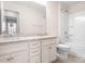 Bright bathroom featuring a toilet, bathtub/shower combo, and granite counters with double sinks at 14611 Murfield Ct, Charlotte, NC 28278