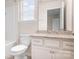 Bright bathroom featuring a toilet, bathtub/shower combo, and granite counters with double sinks at 14611 Murfield Ct, Charlotte, NC 28278