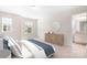 This bedroom features bright light from a window and a view to the en suite bathroom at 14611 Murfield Ct, Charlotte, NC 28278