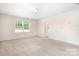 Bright bedroom featuring plush carpeting and an open doorway to another room at 14611 Murfield Ct, Charlotte, NC 28278