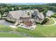 Aerial view of the clubhouse with outdoor seating, landscaping, and green space at 14611 Murfield Ct, Charlotte, NC 28278