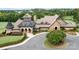 Exterior of the community clubhouse featuring stone and brick construction and landscaping at 14611 Murfield Ct, Charlotte, NC 28278