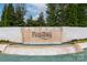 The Palisades neighborhood entrance with an elaborate stone water feature at 14611 Murfield Ct, Charlotte, NC 28278