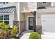 A close up front view of the facade with address, landscaping and stone detail at 14611 Murfield Ct, Charlotte, NC 28278