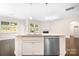 Kitchen island open to the living room, stainless steel appliances and granite countertops at 14611 Murfield Ct, Charlotte, NC 28278
