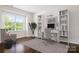 Well-lit home office featuring stylish built-in shelving, a desk, and a comfortable chair at 14611 Murfield Ct, Charlotte, NC 28278