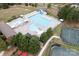 Aerial view of a community pool with lounge chairs and a slide at 14611 Murfield Ct, Charlotte, NC 28278
