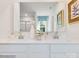 Modern bathroom with double sinks, quartz countertops, and a large mirror, creating a bright and functional space at 1511 River Cane St, Edgemoor, SC 29712