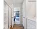 Well-lit bathroom with a glass-enclosed shower, white vanity, and an open doorway leading to the main bedroom at 1511 River Cane St, Edgemoor, SC 29712